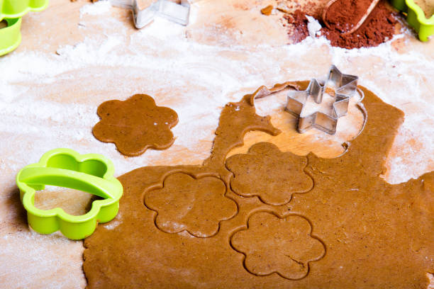 istock Preparing Christmas gingerbread cookies. Gingerbread dough and cookies ingredients. 896938606