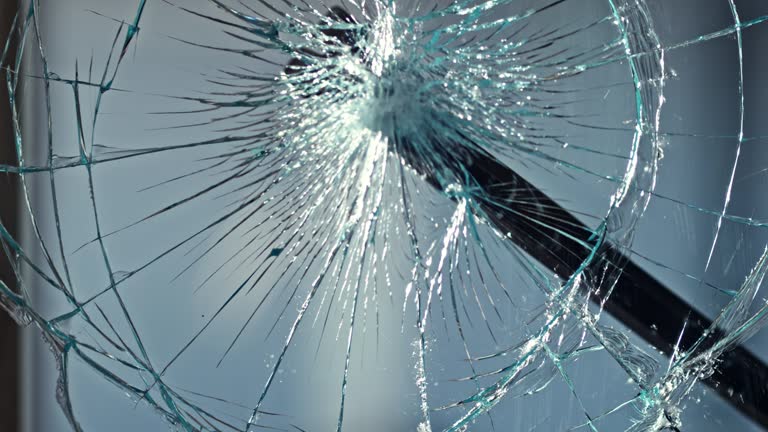 SLO MO LD Pry bar smashing a glass window