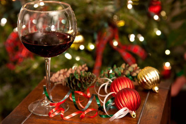 istock Wine glass on table with Christmas decorations 896940144