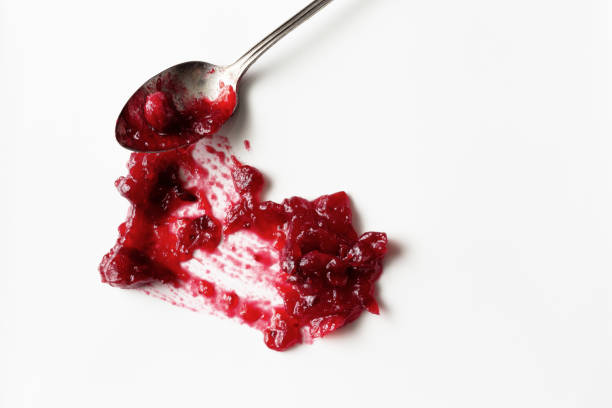 istock Homemade cranberry sauce smeared on a white plate. 896942436