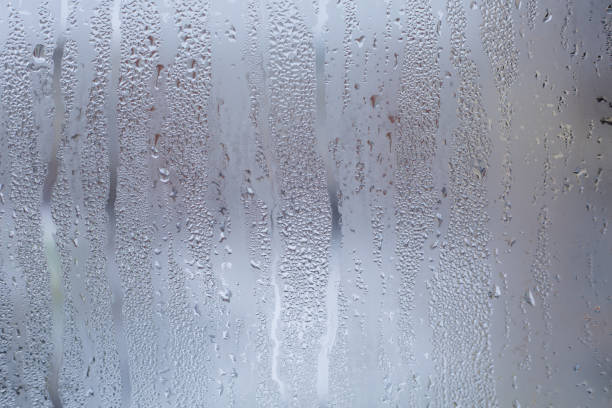 istock Water drops background on glass window. 896942550