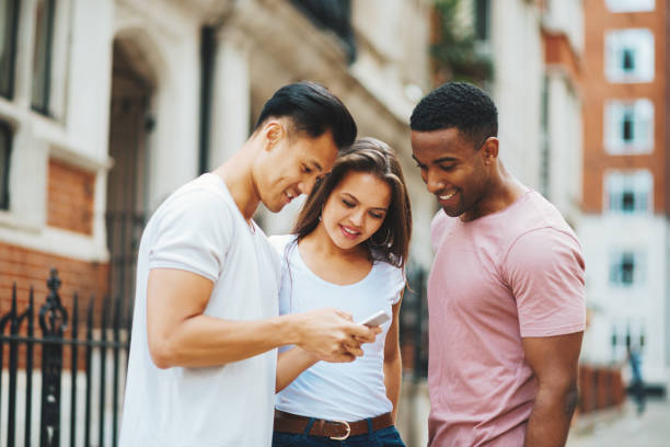 istock Group of multi ethnic people using smartphone for social media content 896962766