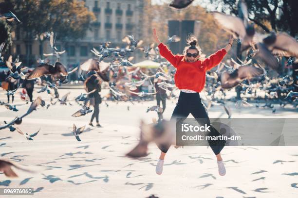 Girl Jumping From Joy In Barcelona Stock Photo - Download Image Now - Ecstatic, Travel, Happiness