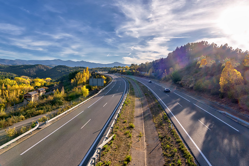 Autopista A-6 en España, con vegetación de follaje de otoño; vista de ángulo alto photo