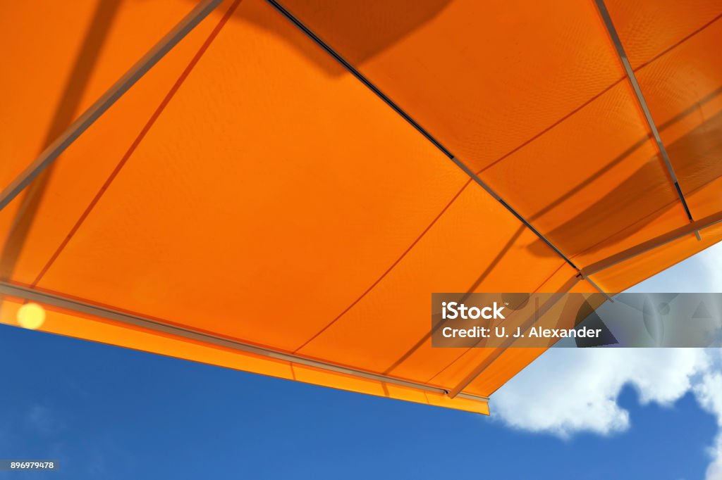 Awning against a blue sky Modertn awning against a blue sky Canopy Stock Photo