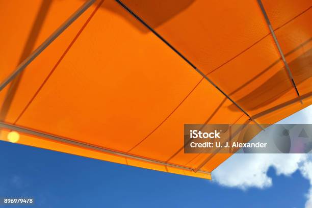 Awning Against A Blue Sky Stock Photo - Download Image Now - Canopy, Patio, Awning