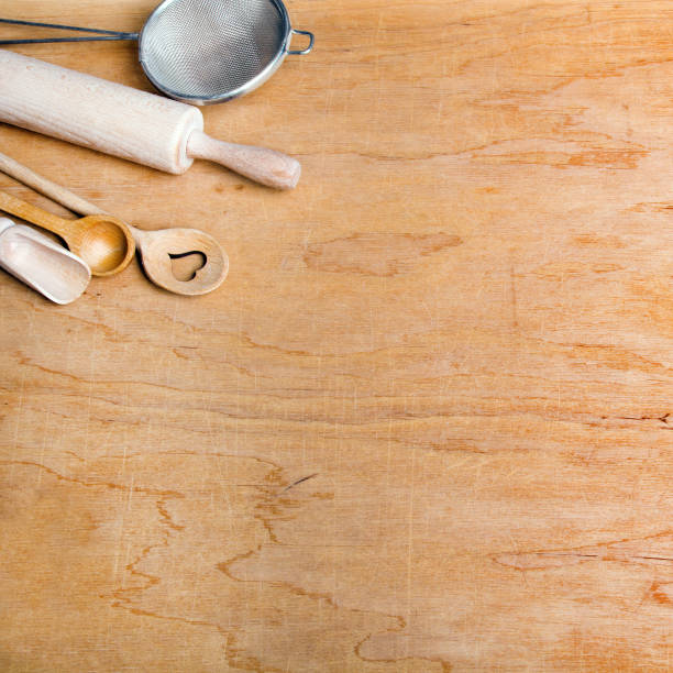 istock Wooden kitchen utensils on a wooden background, copy space 896983774