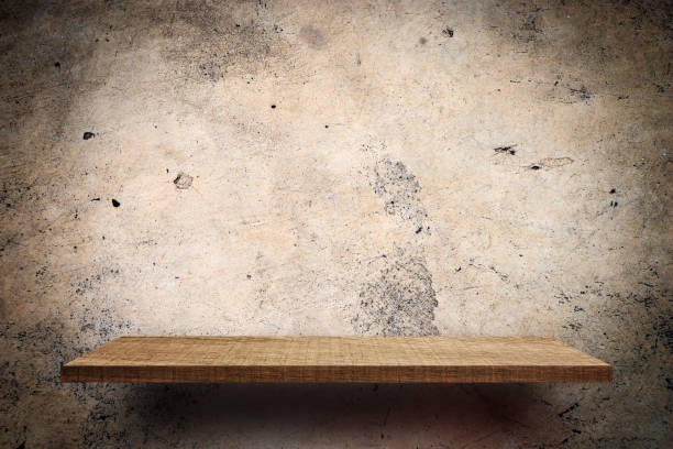 istock Empty Wooden shelf on concrete grungy wall 896992558