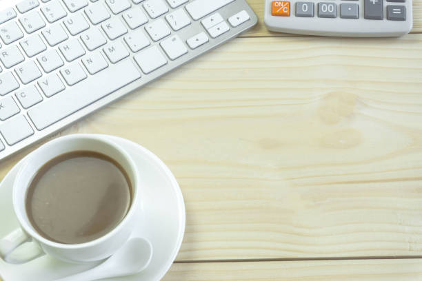 istock Office desk with copy space. Digital devices wireless keyboard and mouse on office table with notepad and cup of coffee,you can apply to your product. 896997120