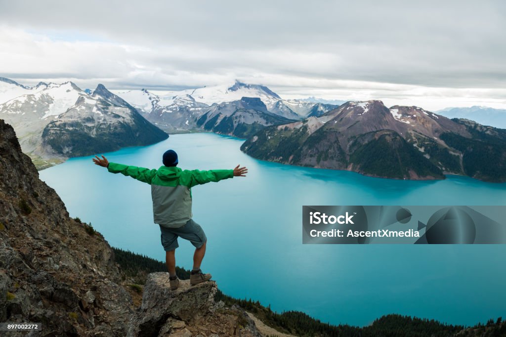 Mountain Adventure Man hiking in the mountains African Ethnicity Stock Photo