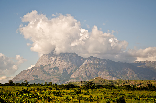 Capped with clouds, Mount Mulanje rises above southern Malawi.