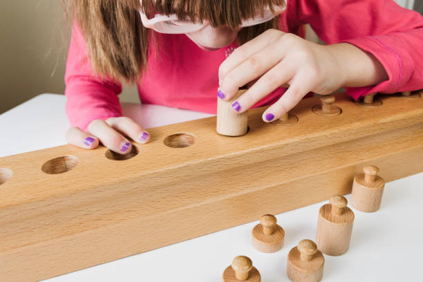 istock Little girl playing with educational toys 897014624