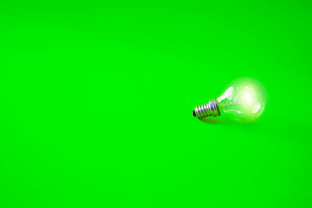 istock light bulb on green background vertical, ideas, eco, money, intelligence concept 897020406
