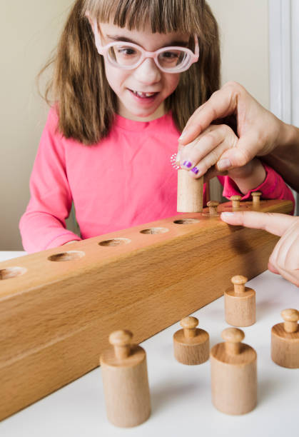 istock Little girl playing with educational toys 897020918
