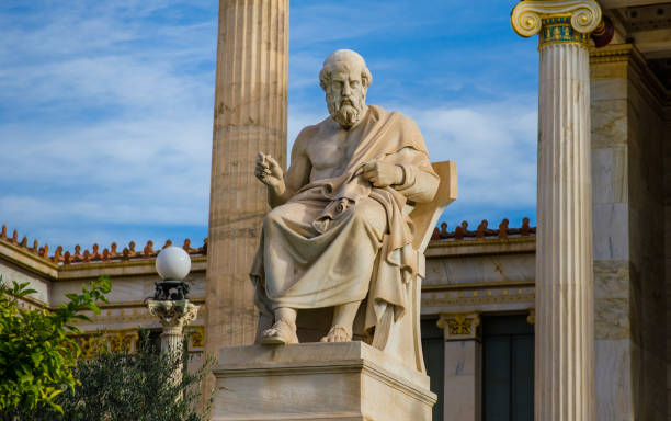 istock Ancient statue of the great philosopher Plato on background of Greek classical columns. 897023466