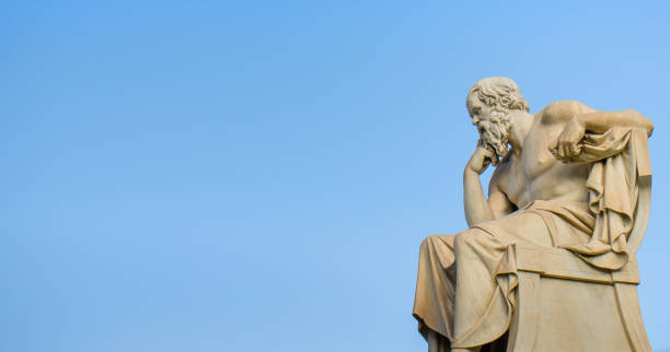 istock Ancient marble statue of the great Greek philosopher Socrates on background the blue sky. 897023532