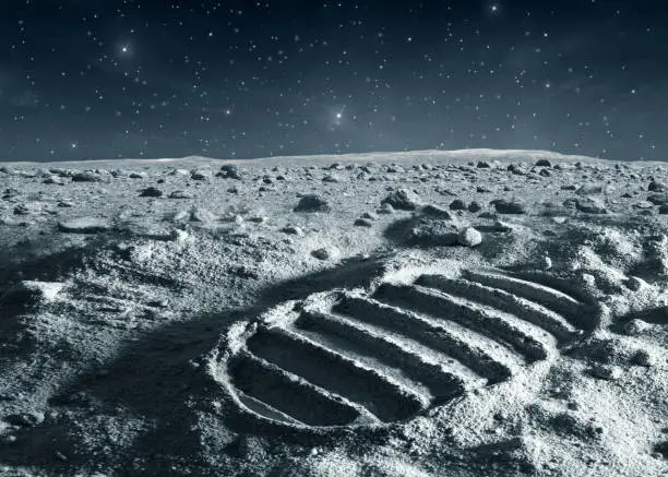Footprint of astronaut on the moon with stars on the dark sky