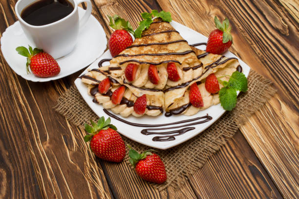 istock Crepes with Banana and strawberries 897026336