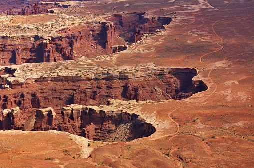 Aerial view of steep canyons from the top of a high mesa, Island In The Sky, Canyonlands National Park, Utah, USA
