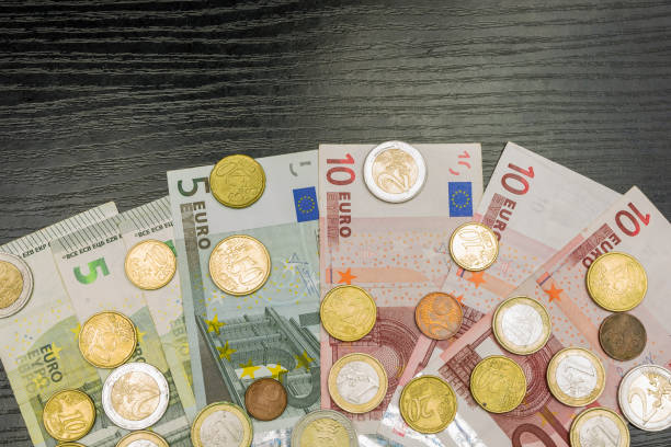 istock Euro coins and banknotes of various denominations 897034704