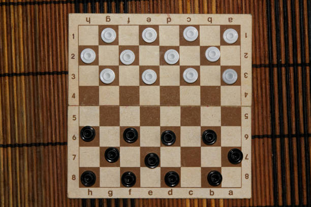 istock Checkers in checkerboard ready for playing. Game concept. Board game. Hobby. checkers on the playing field for a game. 897038634