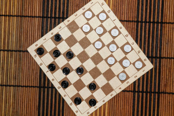 istock Checkers in checkerboard ready for playing. Game concept. Board game. Hobby. checkers on the playing field for a game. 897039442