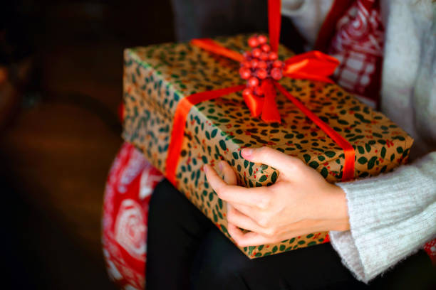 istock Female hands opening Christmas gift box 897053098