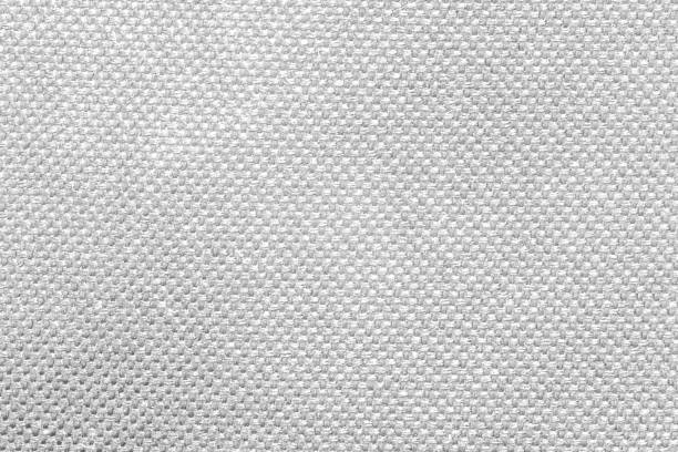 textured white fabric cloth texture with natural patterns can be used as background. closeup view - embroidery needlecraft product composition canvas imagens e fotografias de stock