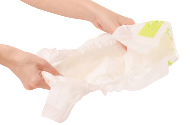 istock Children's diaper female hand 897056836