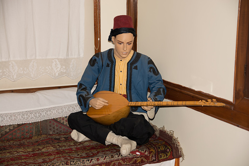 instrument(saz) playing model. Anatolian motif. old turkish tradition