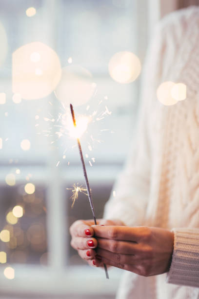 Sparkler Close up of woman hands holding sparkler 3686 stock pictures, royalty-free photos & images