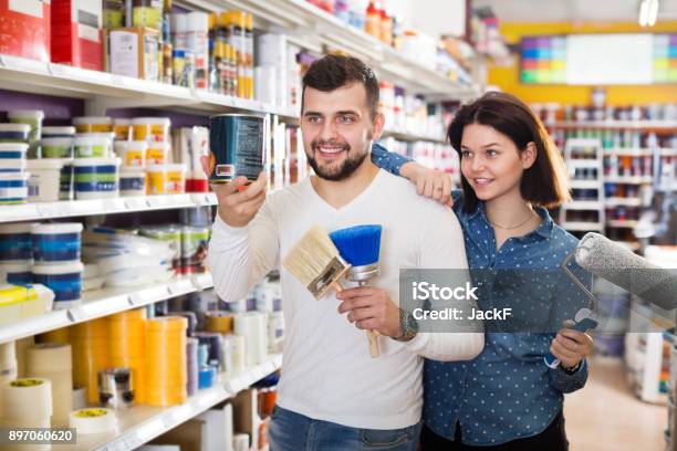 Couple Deciding On Best Color Scheme Stock Photo - Download Image Now - Store, Shopping, Customer