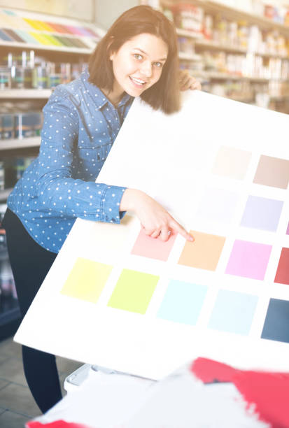istock Young female is deciding on best color scheme 897060656