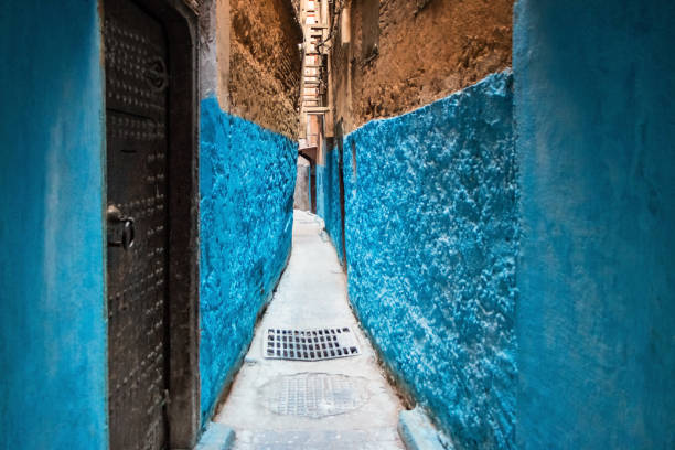 Stock photograph of a narrow alley in old town Fez, Morocco.