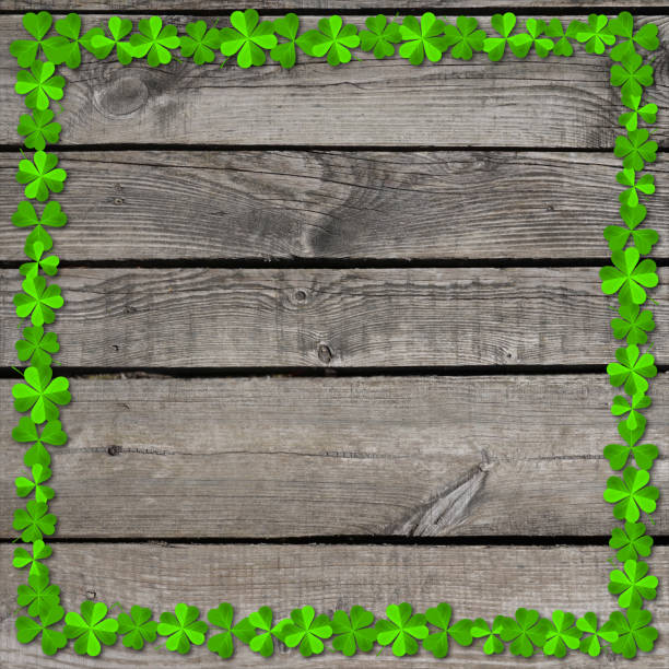 istock St. Patrick's Day illustration - wooden background, clover frame 897071064