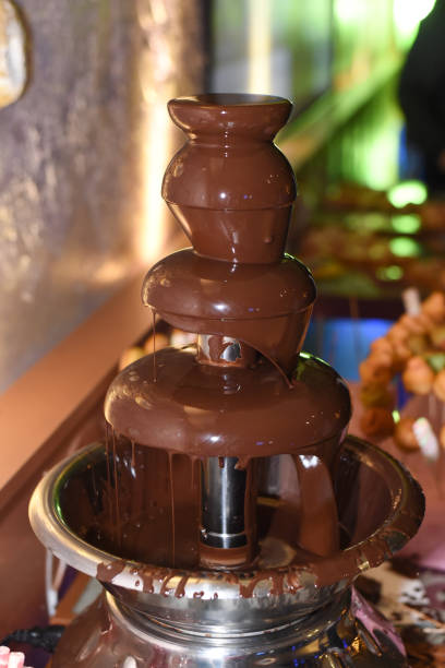 istock Chocolate fountain with fruits 897073458