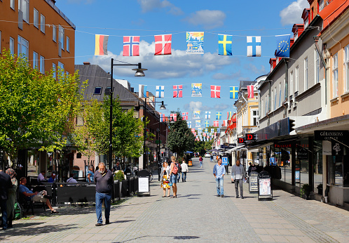 Karlshamn, Sweden - August 23, 2017: The shopping street Drottninggatan in the center of Karlhamn is a pedestrian street.