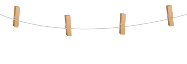 Clothes pins on a clothes line rope  - four wooden pegs holding nothing. Clothes pins on a clothes line rope  - four wooden pegs holding nothing. clothespin stock illustrations