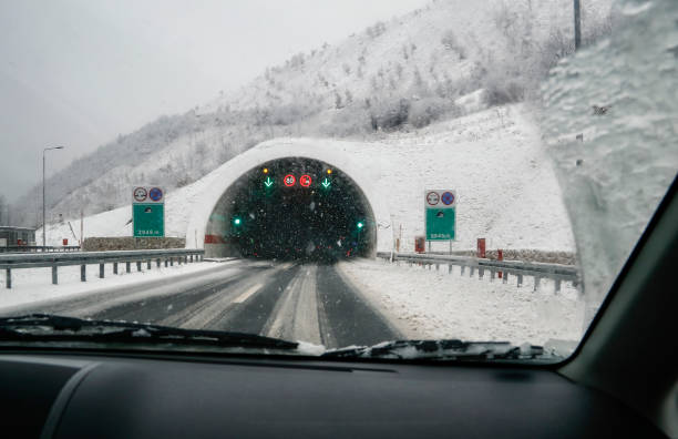 istock Entrance to the modern road tunnel. Looking Through Windshield, 897077960