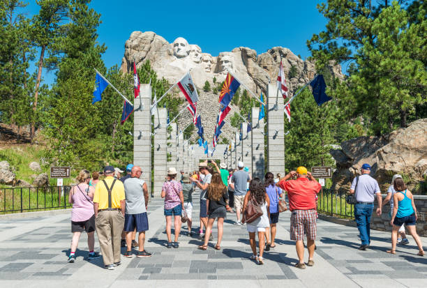 Mount Rushmore National Monument Entrance The Entrance of the Mount Rushmore National Monument on a sunny summer day with tourists and taking photographs of the view, Black Hills National Forest, South Dakota, USA. theodore roosevelt us president stock pictures, royalty-free photos & images