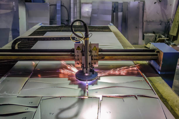 istock Plasma cut machine with program control cutting steel sheet with sparks in metalwork factory 897081716
