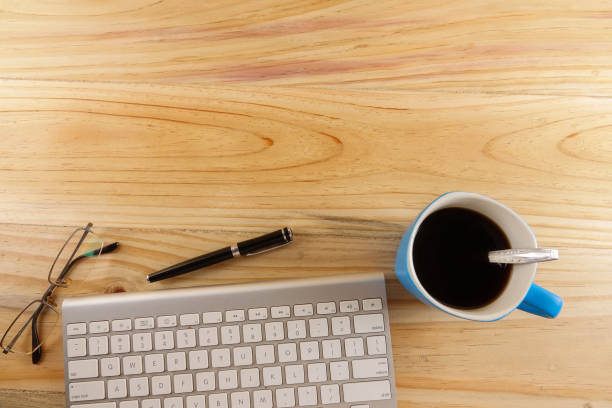 istock Close-Up Of Coffee Cup And Laptop On Table 897081922