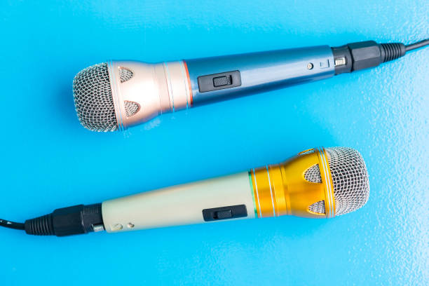 istock Close-Up Of Microphones On Blue Background 897097988