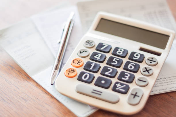 istock Close-Up Of Calculator With Pen And Passbook On Table 897103350