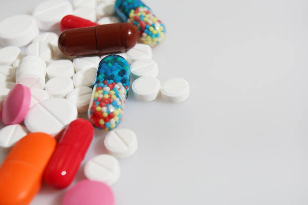 istock Colorful pills closeup on white background 897125690