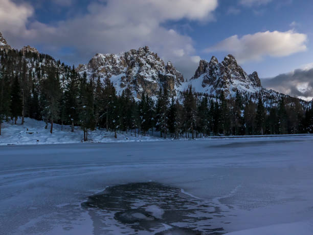istock Frozen alpine lake and mountain landscape at dusk 897125974
