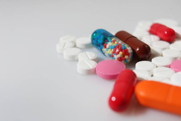 istock Colorful pills closeup on white background 897126318