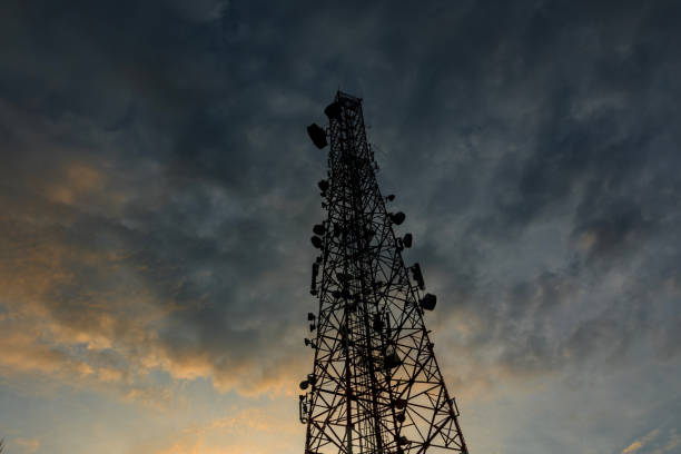 istock High tech telecommunication tower at sunrise with cloud 897133346