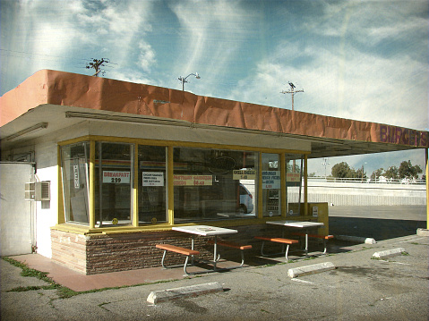 aged and worn urban fast food restaurant