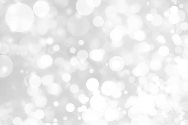 istock Abstract background with White bokeh on gray background. christmas blurred beautiful shiny Christmas lights. 897146732